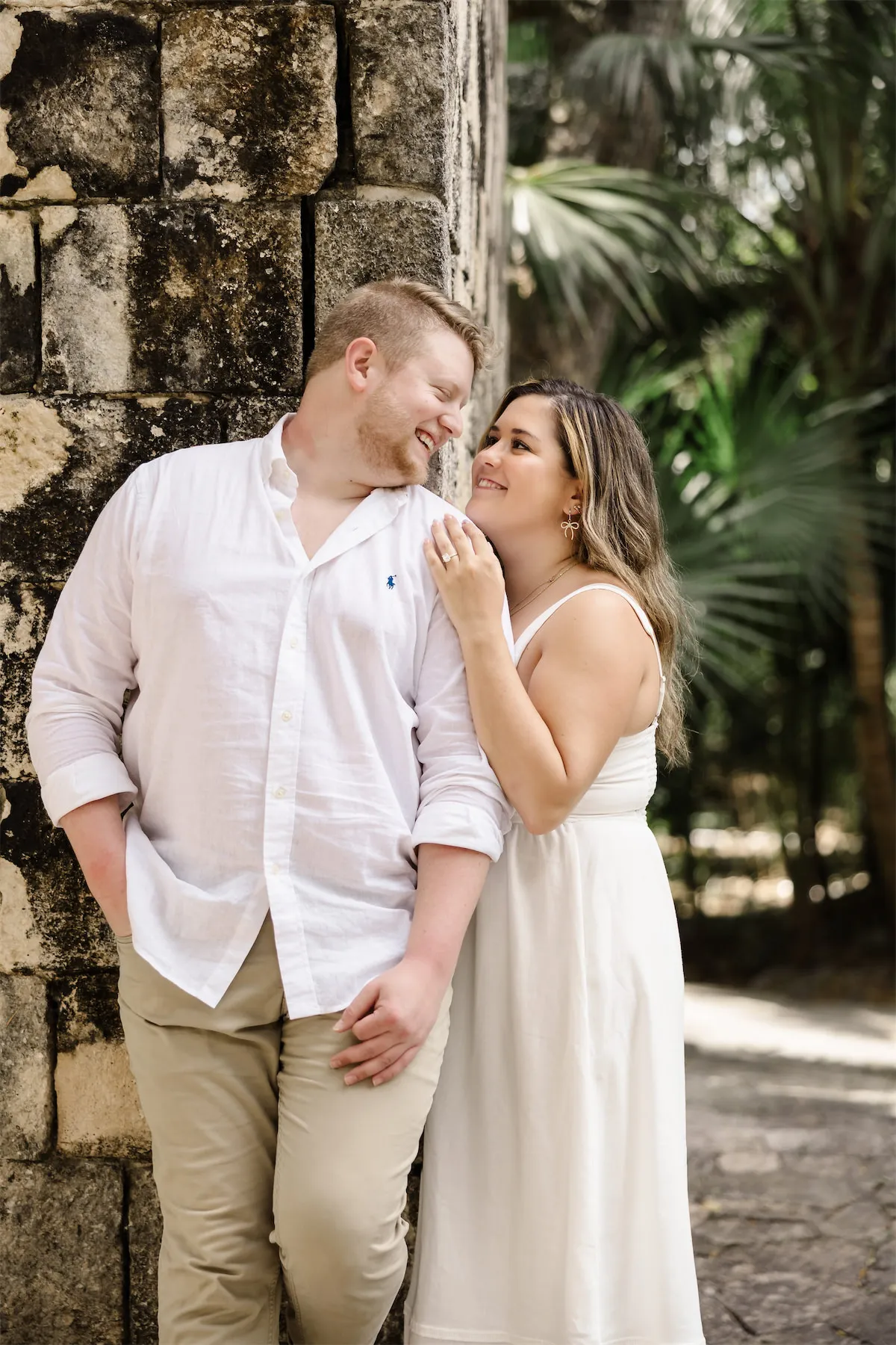 Romantic engagement portrait by the stone ruins at Chankanaab Park in Cozumel
